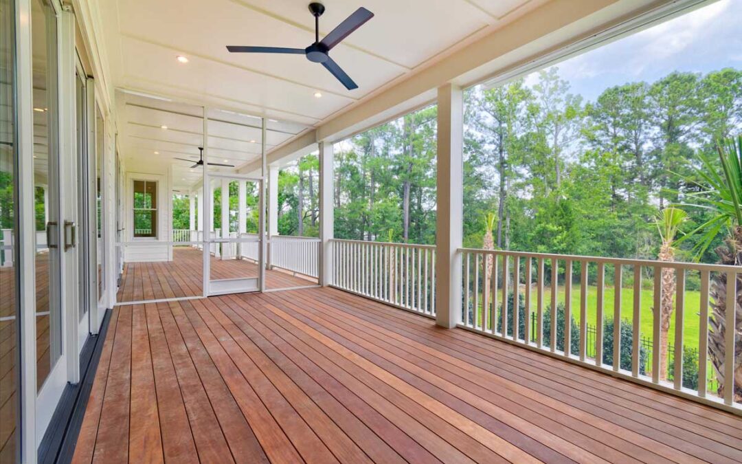 This back porch includes open and screened areas, with durable teak flooring.