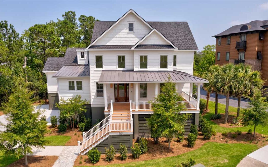 This elevated 2 story home features Anderson impact rated windows, Garapa hardwood decking, metal standing seam roof, and Bella stone? pavers.