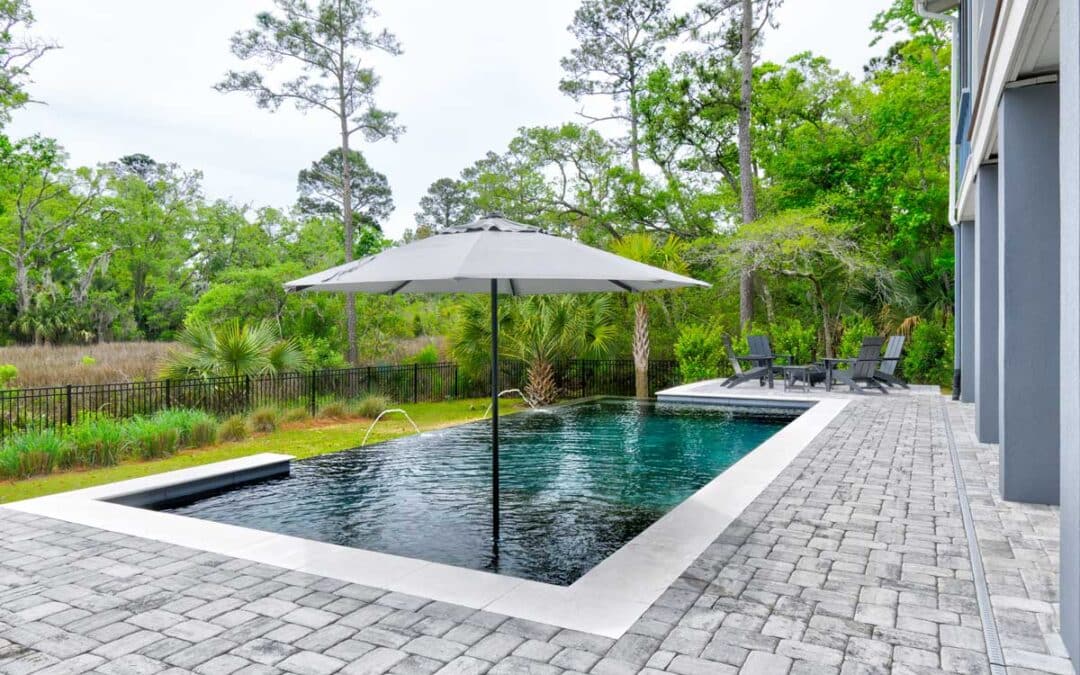 An infinity pool enhances the views of the salt marsh behind this home