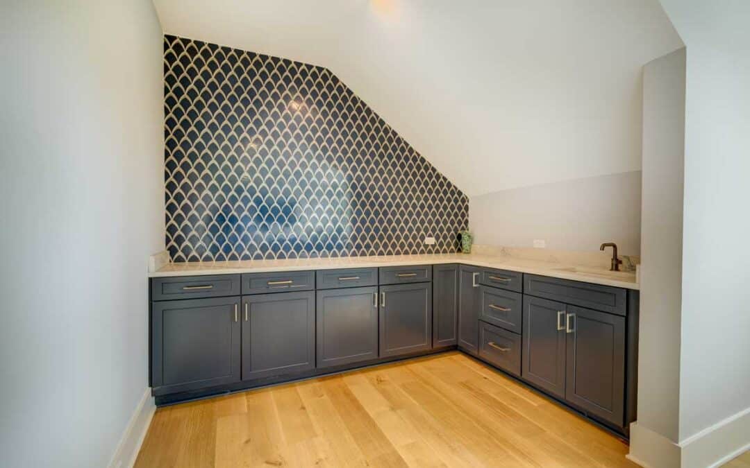 A full wet bar is tucked into the corner of this living area