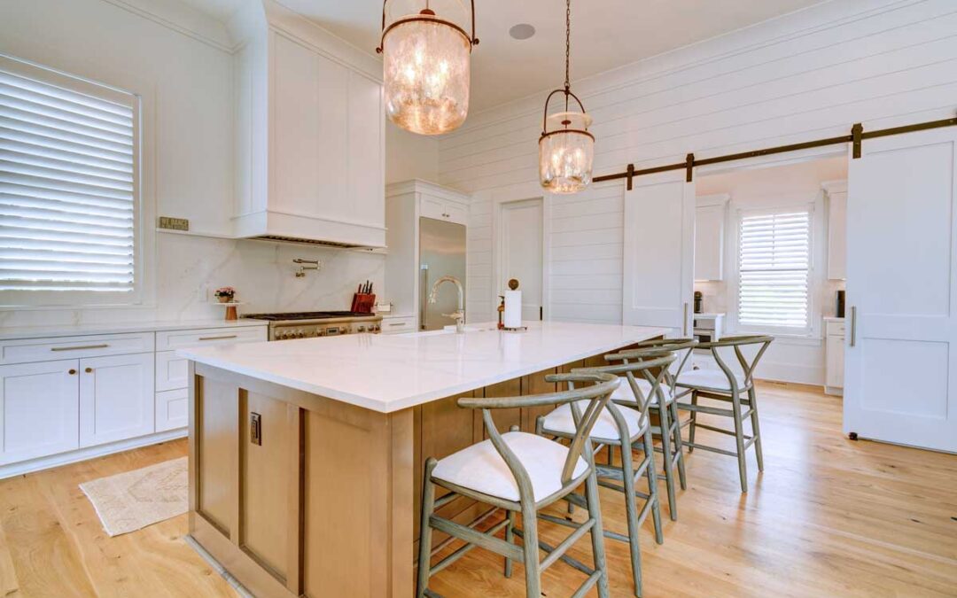 The kitchen centers around a large marble-topped island perfect for casual meals and entertaining