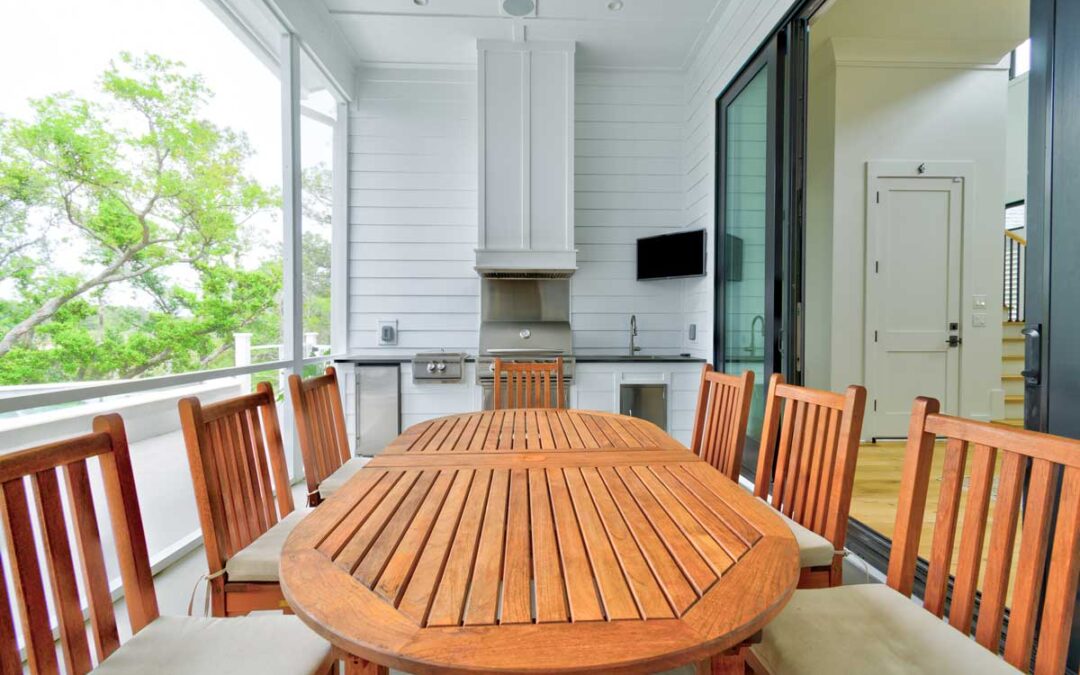 A comfortable cook station and dining area on the back porch